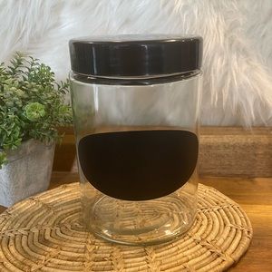 Clear canister with black lid and chalkboard label